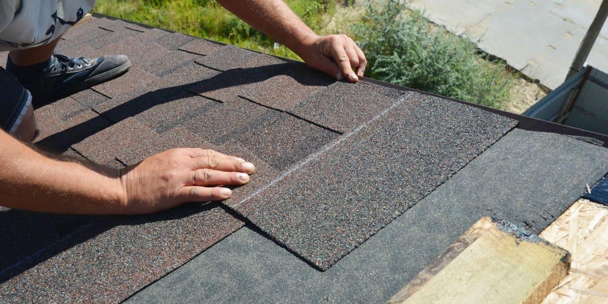 a-roofer-putting-shingles-on-a-roof